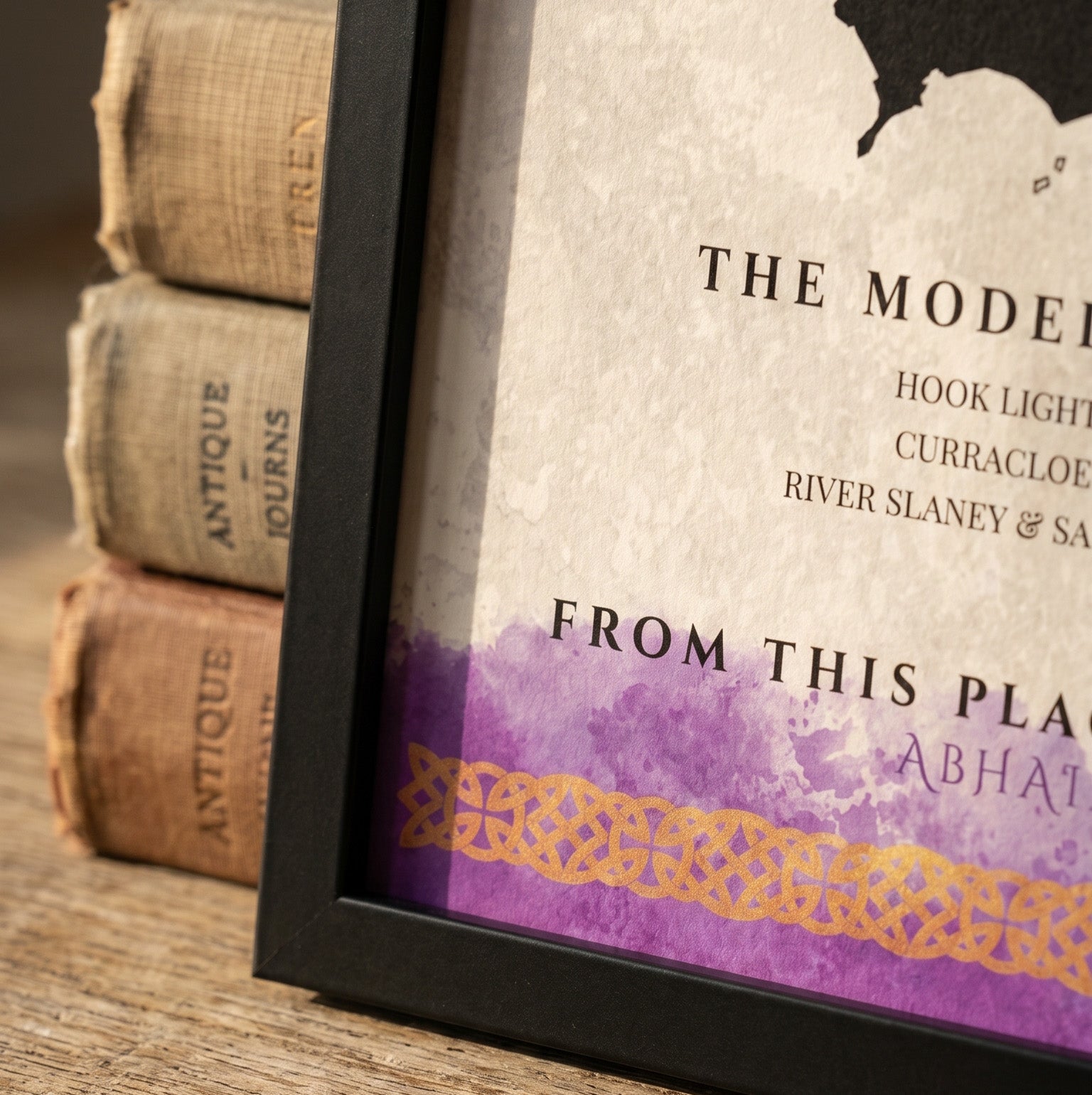 Framed map with decorative elements on a wooden surface